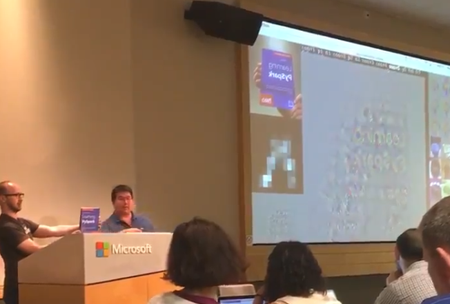 Denny and Tom on stage presenting PySpark and TensorFrames